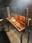 turning real sweet maple and wild cherry wood into charcoal for the certified angus beef ribeyes