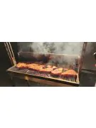 certified angus beef ribeyes on the grill cooking